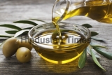 Bottle,Pouring,Virgin,Olive,Oil,In,A,Bowl,Close,Up