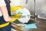 A,Young,Woman,In,Yellow,Gloves,Washes,Dishes,With,A