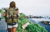Back,View,Of,African,American,Female,Tourist,With,Backpack,Exploring