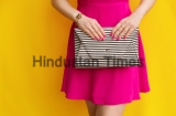 Outdoor,Fashionable,Girl,In,Pink,Dress,With,Striped,Handbag,Clutch