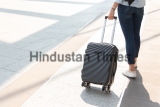 Close,Up,Woman,And,Suitcase,Trolley,Luggage,In,Airport.,People