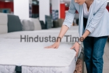 Partial,View,Of,Woman,Touching,Orthopedic,Mattress,In,Furniture,Shop