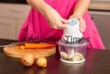 Detail,Of,Female,Hands,Turning,On,An,Onion,Chopper,On