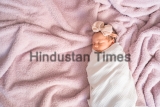 Portrait,Of,Baby,Infant,Sleeping,On,Soft,Furry,Bed,In