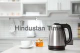 Modern,Electric,Kettle,,Cup,And,Honey,On,Wooden,Table,In