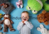 Happy,One,Year,Old,Boy,Lying,With,Many,Plush,Toys