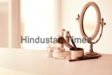 Set,Of,Cosmetics,And,Vintage,Mirror,On,White,Table,Against