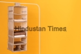 Foldable,Organizer,On,Rack,Against,Yellow,Background.,Space,For,Text