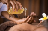 Closeup,Of,Masseur,Hands,Pouring,Aroma,Oil,On,Woman,Back.