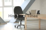 Wooden,Table,With,Laptop,And,Chair,In,Office