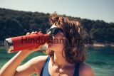 A,Beautiful,Girl,Drinking,From,A,Steel,Water,Bottle,At