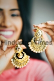 Young,Beautiful,Indian,Woman,Holding,A,Pair,Of,Gold,And