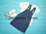 Set,Of,Child's,Clothes,On,Wooden,Background
